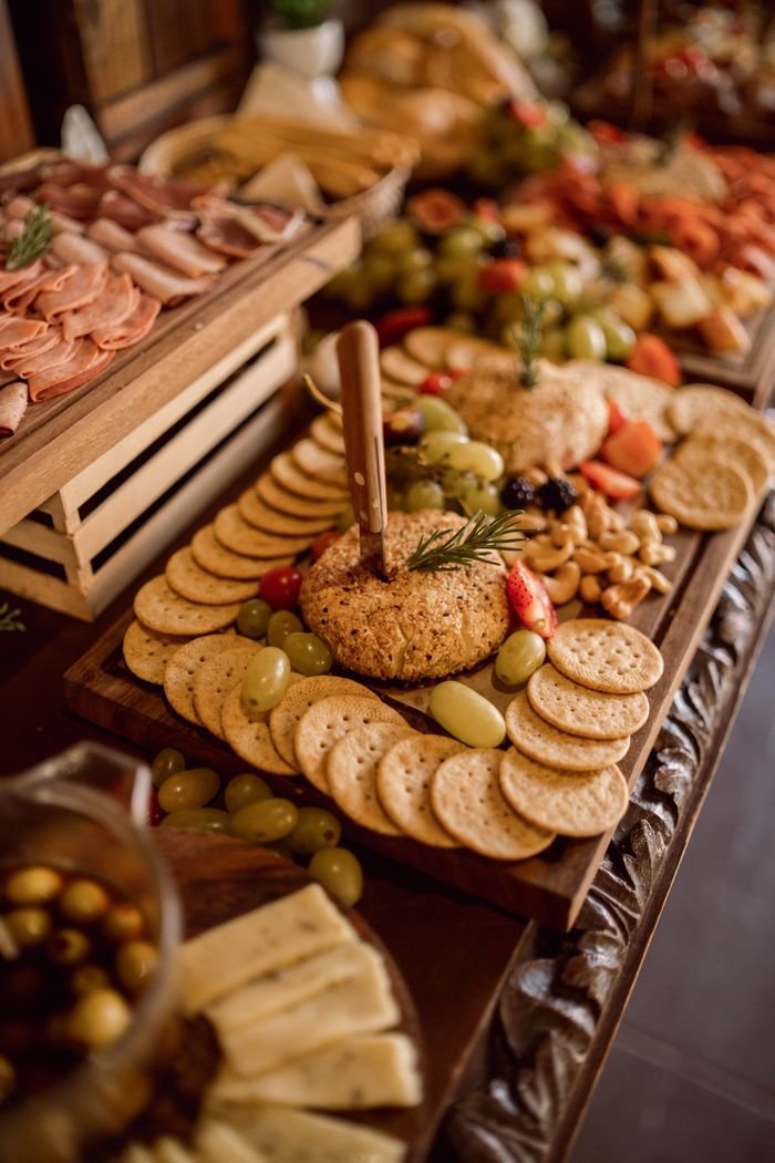Crafting Captivating Headlines: Your awesome post title goes here A beautifully arranged grazing table featuring cheeses, cold meats, fruits, and crackers.